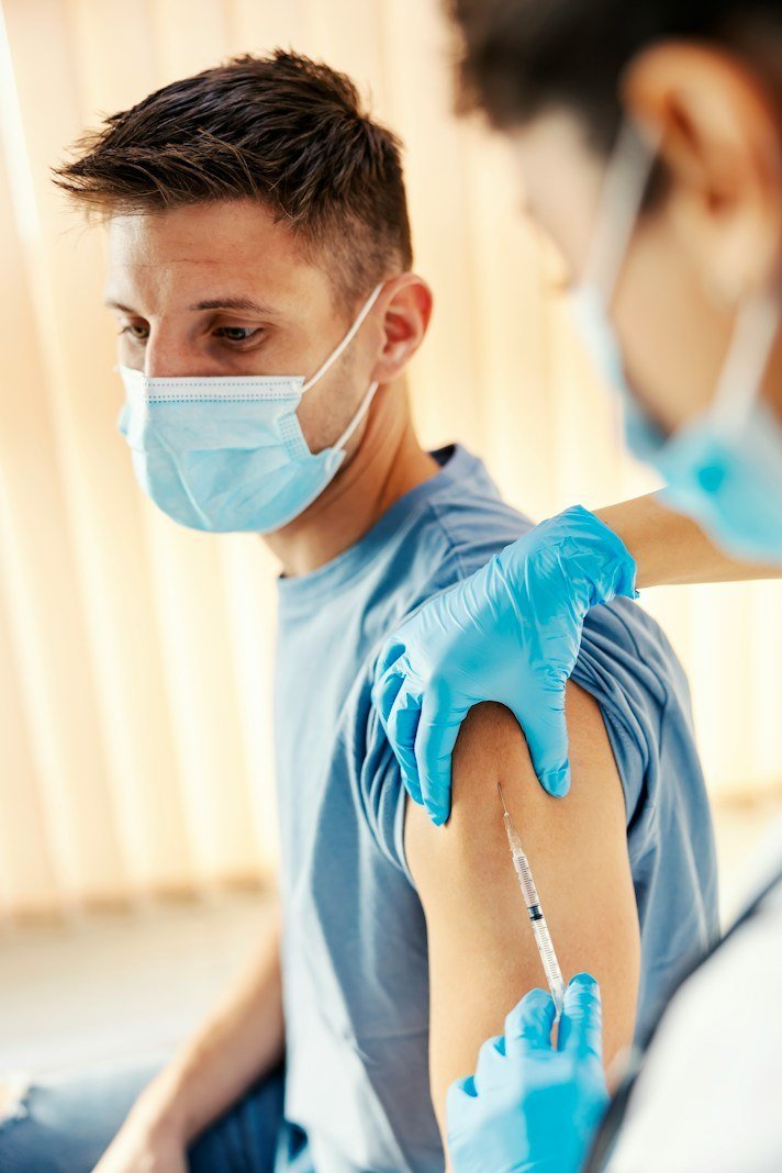 Patient receiving a vaccine during the vaccination drive