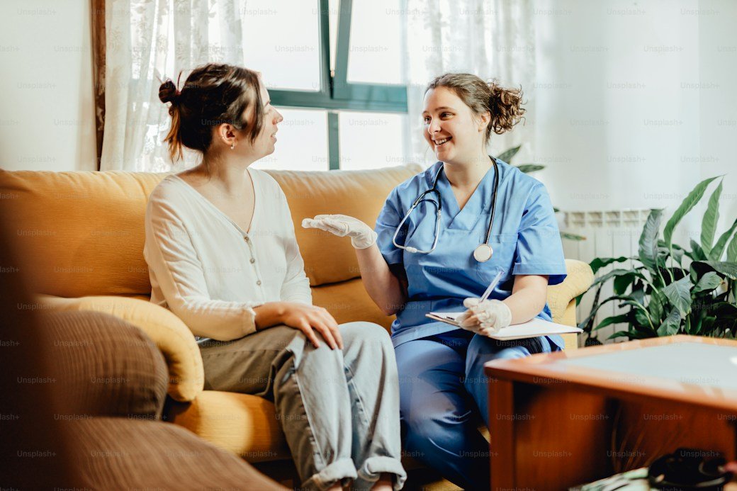 A nurse talking with a patient during a health checkup